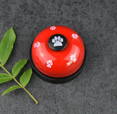 Pawlio Paw Press Training Bell with a wooden frame and metal bell for dog training and communication.