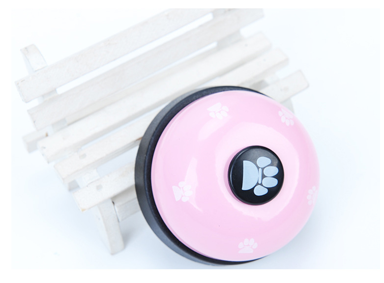 Pawlio Paw Press Training Bell with a wooden frame and metal bell for dog training and communication.