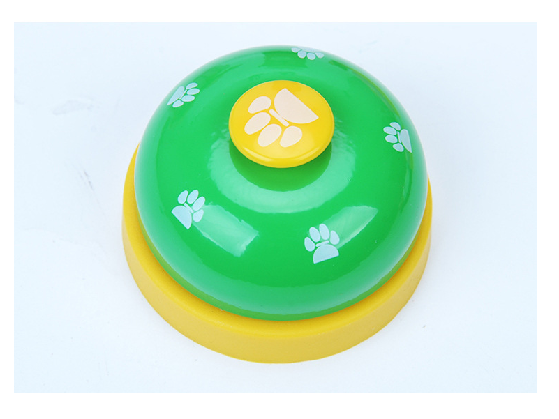 Pawlio Paw Press Training Bell with a sturdy metal base and a small, colorful bell for dog training and communication exercises.
