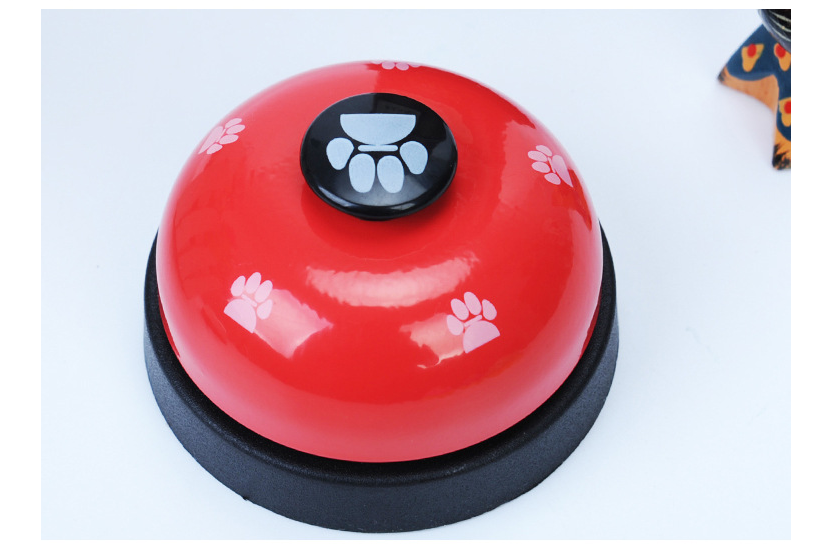 Pawlio Paw Press Training Bell with a wooden frame and metal bell for dog obedience training and interactive learning.