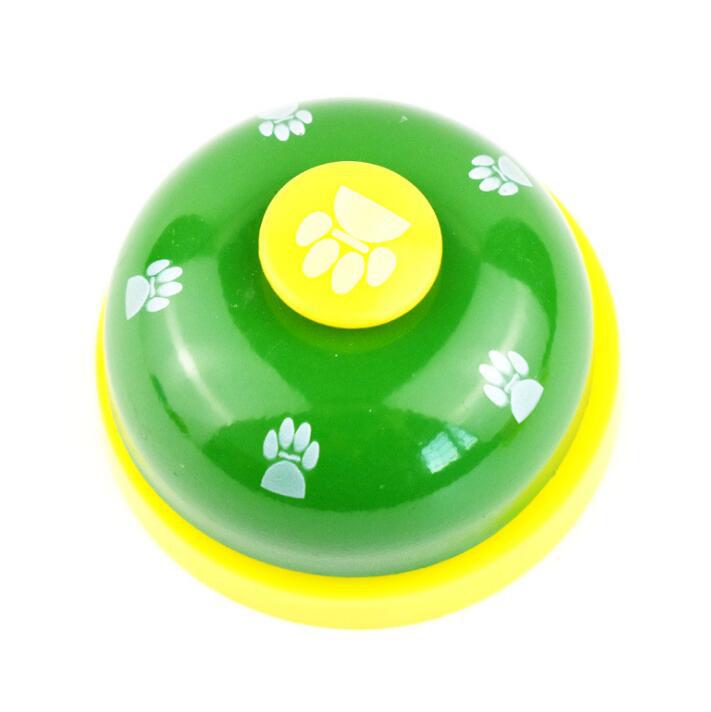 Pawlio Paw Press Training Bell with a metal button and colorful base for dog training and behavior reinforcement.