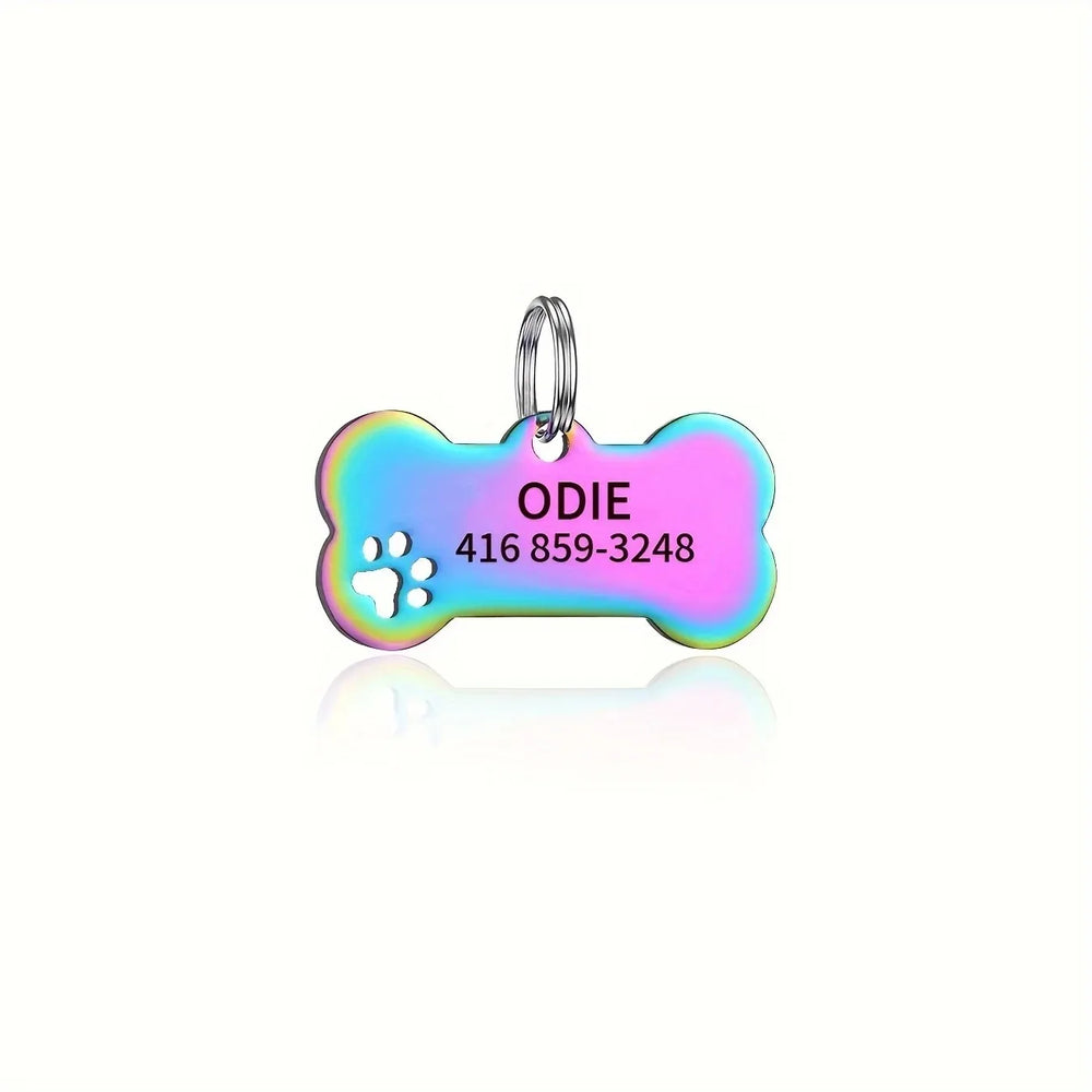 Personalized engraved bone-shaped pet tag by Pawlio with pet name and phone number for dog or cat identification.