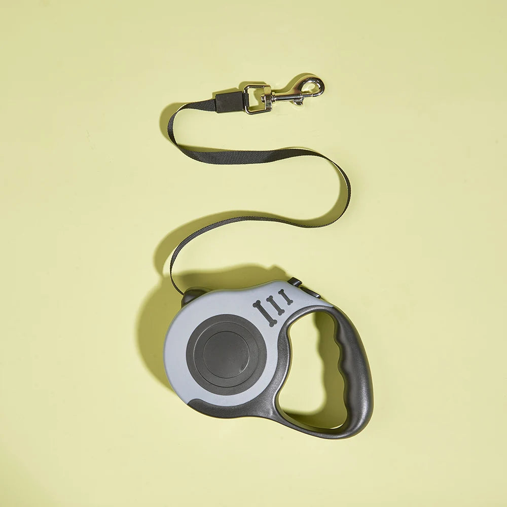 Pawlio™ Automatic Retractable Dog Leash with 3m and 5m durable nylon lead, featuring a sleek black handle and locking button.