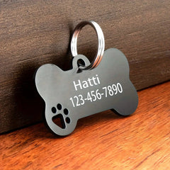 Bone-shaped engraved pet tag by Pawlio with name and phone number for dogs and cats, high-quality personalized pet identification.