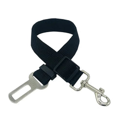 Adjustable Pawlio™ dog car seat belt and safety harness attached to a dog, ensuring secure travel in a vehicle.