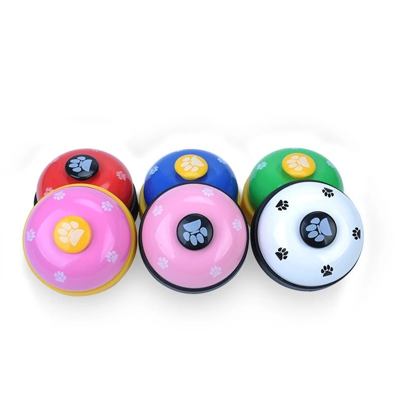 Pawlio Paw Press Training Bell for dogs, showing a colorful button with a paw print design, used for training and communication.