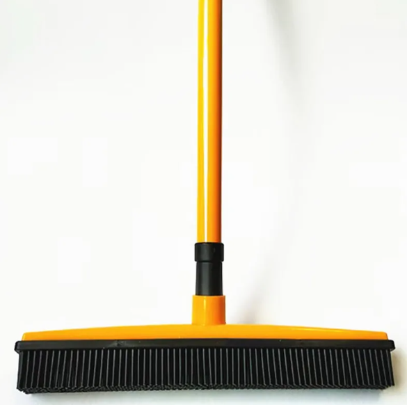 Pawlio pet hair removal broom mop with a wide head and bristles designed to pick up pet hair from floors and carpets.
